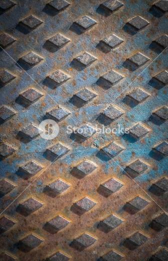 Old Rusty Drain Cover Background With Diamond Pattern Royalty