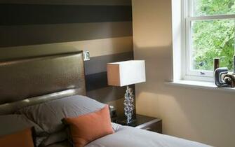 Horizontal Striped Wallpaper Sits Behind A Bespoke Fauz Croc Skin