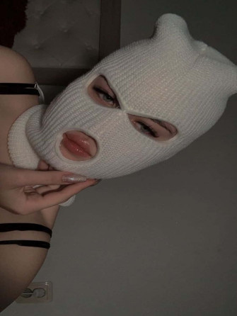 A Woman Wearing Global Ski Mask Ready For Winter Wallpaper