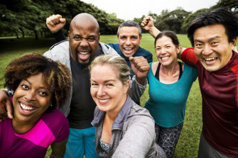 Group Of Cheerful Diverse Friends In The Park Wallpaper