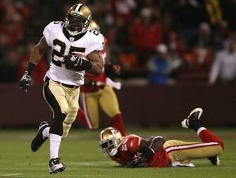Reggie Bush Of The New Orleans Saints Runs Against