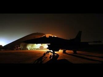 An F Fighter On The Ground At Night