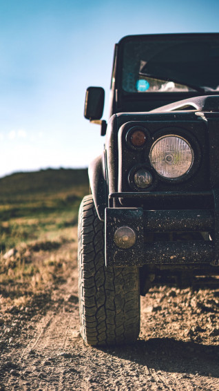 Black Jeep Wrangler On Green Grass Field During Daytime Photo