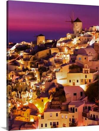 Dusk Over The Aegean Sea And A White Washed Cliff Top Town On