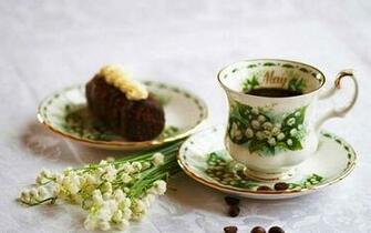 Old Coffee Cup With Beautiful Spring Flowers Lilies