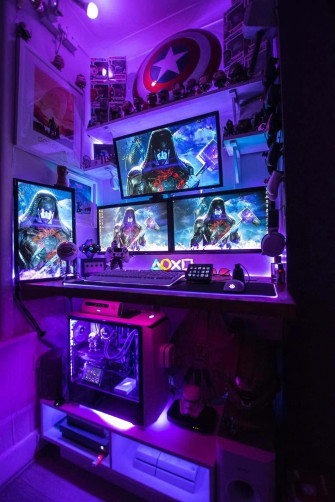 Futuristic Gaming Setup In A Cozy Room Wallpaper