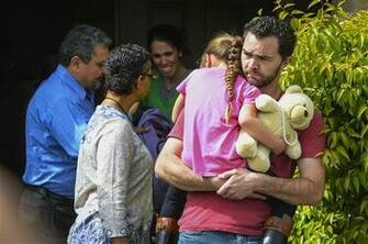 Background Cries As Members Of Family Services Left Arrive To Take