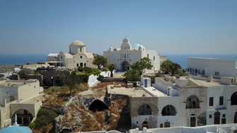 Aerial Footage Of A Cliffside Village In Santorini Greece Stock