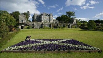Castle With Scottish Flag In Flowers HD Wallpaper