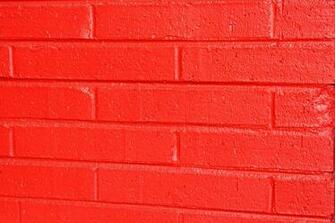 Photograph Features A Close Up Of Brick Wall That Has Been Painted