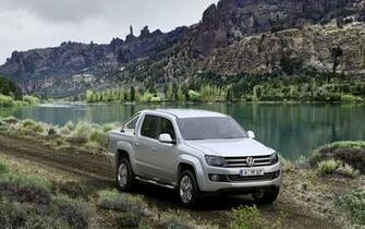 Volkswagen Amarok On A Country Road By The Lake Wallpaper Car