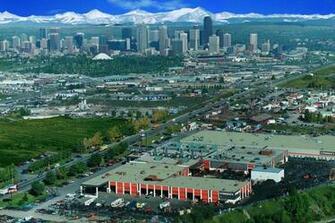 Birds Eye Of Calgary Alberta With Rocky Mountains In