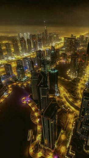 Davinder Singh On Night In Cityscape Wallpaper