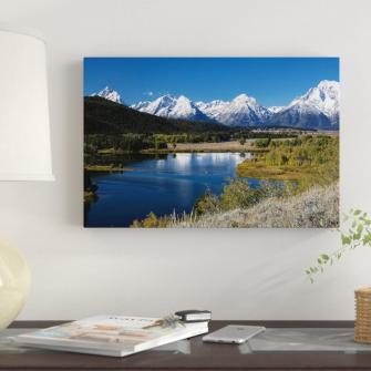 East Urban Home River With Mountain Range In The Background