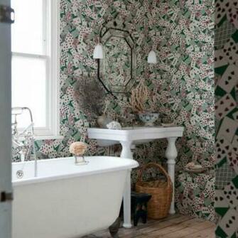 Bathroom With Clawfoot Tub And Patterned Wallpaper