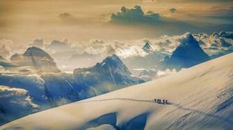 Climbers Ascending Jungfrau In The Bernese Alps Switzerland
