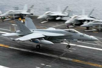 Landing During Flight Operations Aboard The Aircraft Carrier Uss