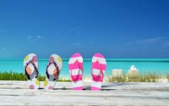 Flip Flops In A Wooden Bench On The Beach