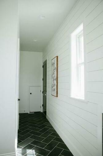 White Shiplap Mudroom With Gray Slate Herringbone Floor