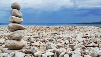 Rock Stacking On Beach HD Wallpaper