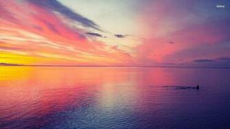 Swimming In The Pink Sunset Wallpaper Beach