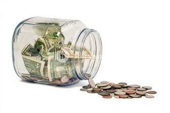 Money Jar Spill On White Background Royalty Stock Image