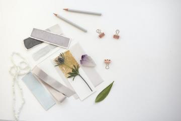 Flowers On Card Near Pencil Photo Desk Image