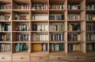 Books On Brown Wooden Shelf Photo Indoors Image