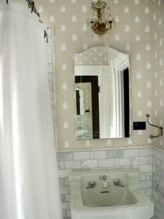 Kid S Bathroom With Subway Tile Walls And Fun Wallpaper