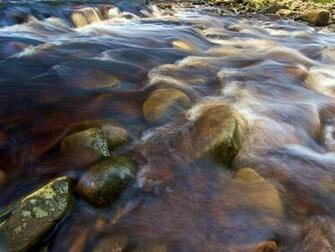 Stream Background Wallpaper Of Colorful Flowing Waters A Mountain