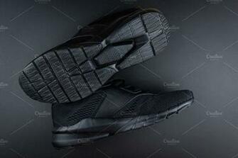 Sneakers On Black Background High Quality Sports Stock Photos
