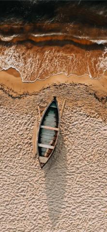 Brown And White Boat On Sand iPhone Wallpaper