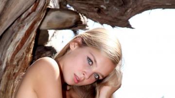 Sienna Tilting Her Head On Hand Wallpaper Girl