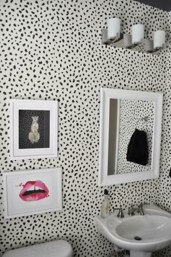 Chic Powder Room Features Thibaut Tanzania Wallpaper Adorned With Made