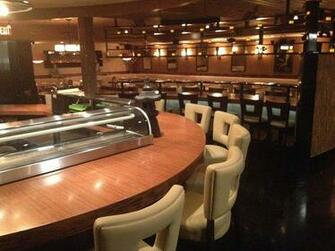 Wok Bamboo Sushi Bar Counter And Dining Room In The Background