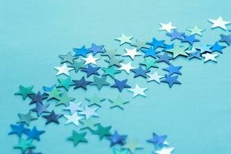 Image Of Blue And Silver Stars Scattered On Teal Background