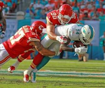 Miami Dolphins Wide Receiver Jarvis Landry Is Tackled By Kansas City