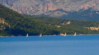 Yellow Boats In The Distance Wallpaper