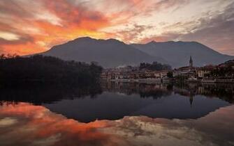 City In Shadow Of Mountain Lake Sunset Wallpaper