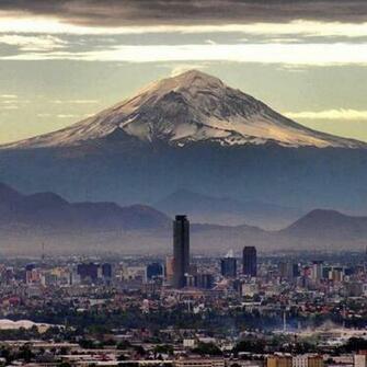 Mexico City With The Popocat Petl Volcano In Background