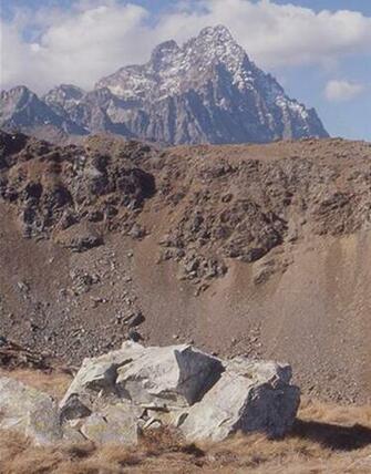 Raw Jadeitite From The Oncino Valley With Mont Viso In Background