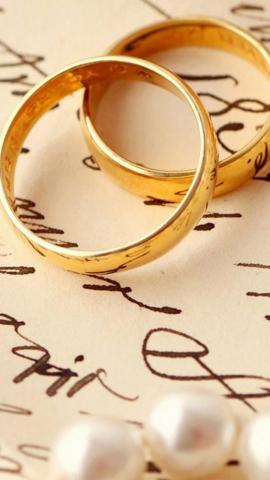 Love Romance Ring Pair On Book iPhone Wallpaper