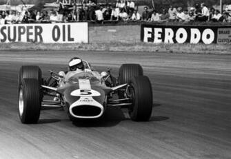Jim Clark Holds A Huge Slide In Lotus Formula Photos Espn