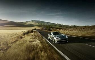 Graue Aston Martin Beschleunigung Vorne Angle Desktop Hintergrund