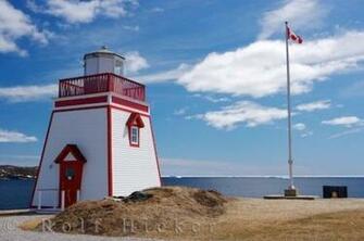 Newfoundland Canada Where The Lighthouse Sits On Top Of Hillside