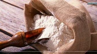 Taking Flour From Bag Wallpaper