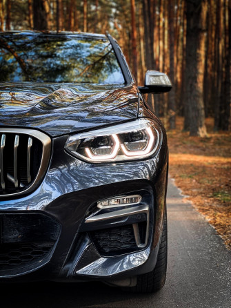 Black Bmw X6 Parking Near Road Photo Image