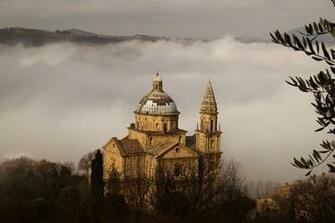Cathedral On The Background Fog In Siena Italy Wallpaper
