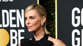 Charlize Theron Wows In Sleek Black And White Look At The