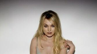 Sophia Myles Touching Her Shoulder Wallpaper